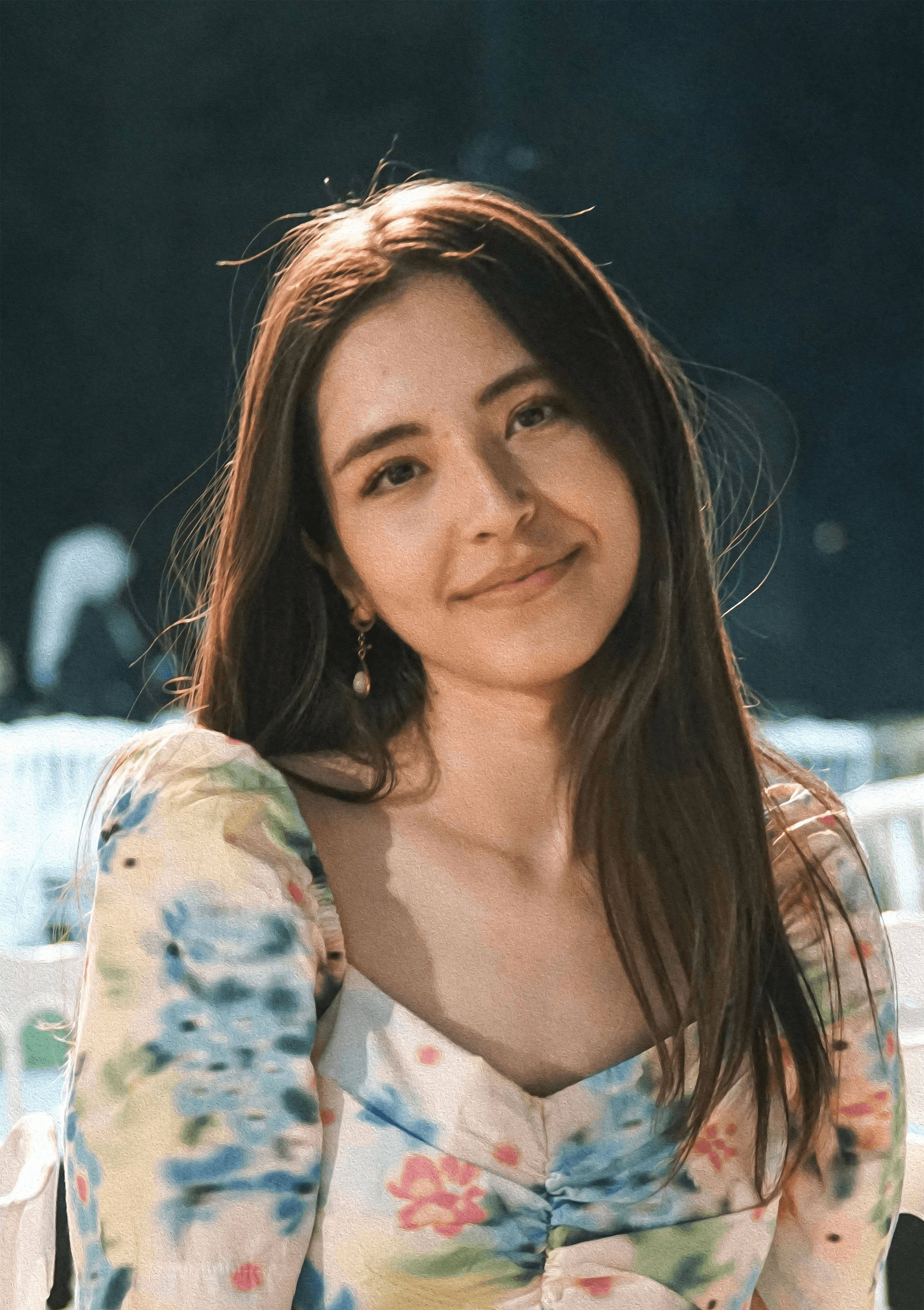 a woman sitting on a white chair next to a table
