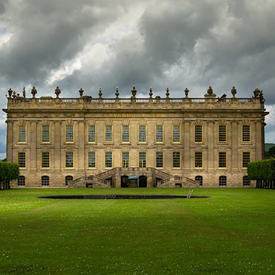 A view acroos the grass of chatsworth house the filming location of pride and prejudice