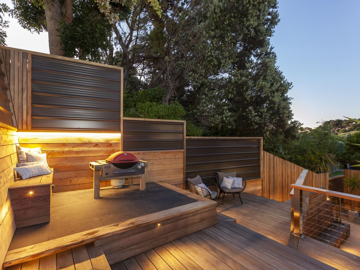 Landscaped deck area with high quality fencing and bbq area