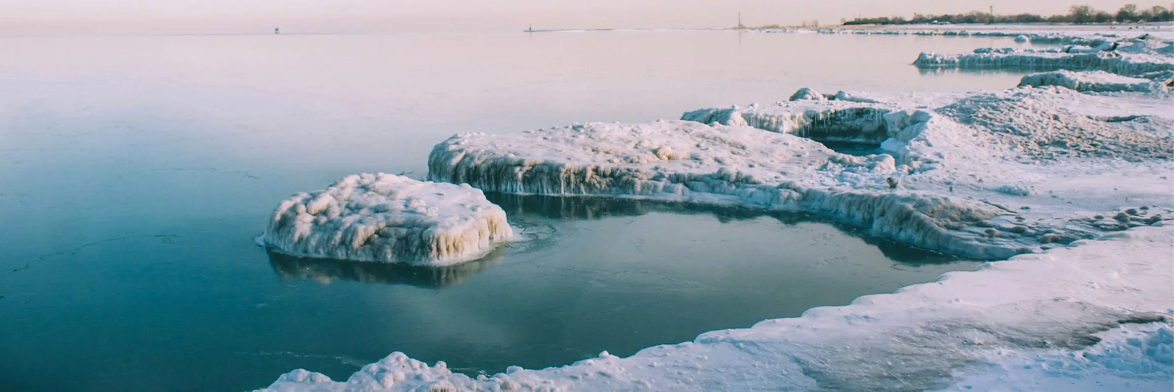 Frozen ice formations along a winter shoreline