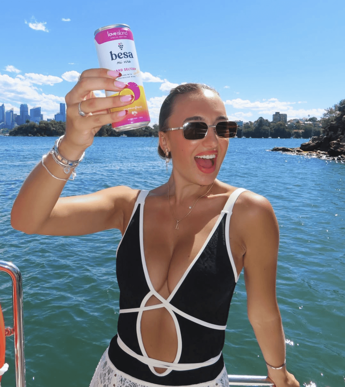 woman holding Besa Wine Seltzer Case.