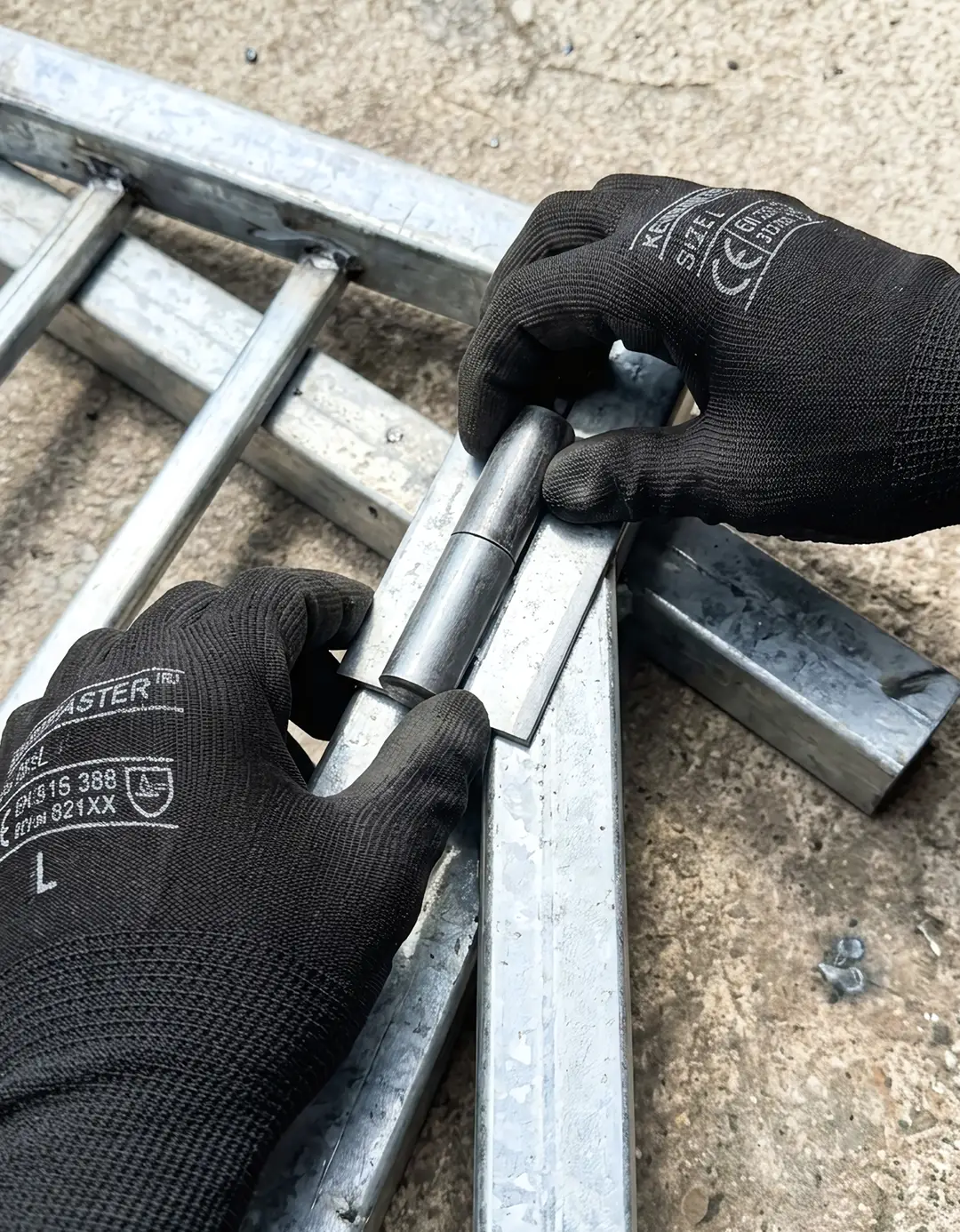 Mobile welder repairing galvanized steel trailer frame onsite in Melbourne