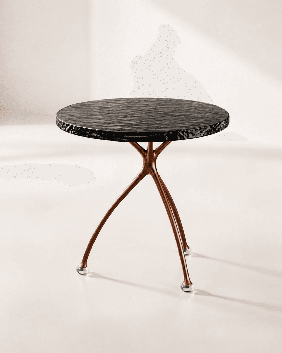 Alternative three-quarter view of Tide Side Table, showing a rippled black-glass disc balanced on exactly three copper feet
