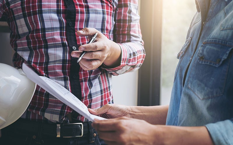 three men discussing issues
