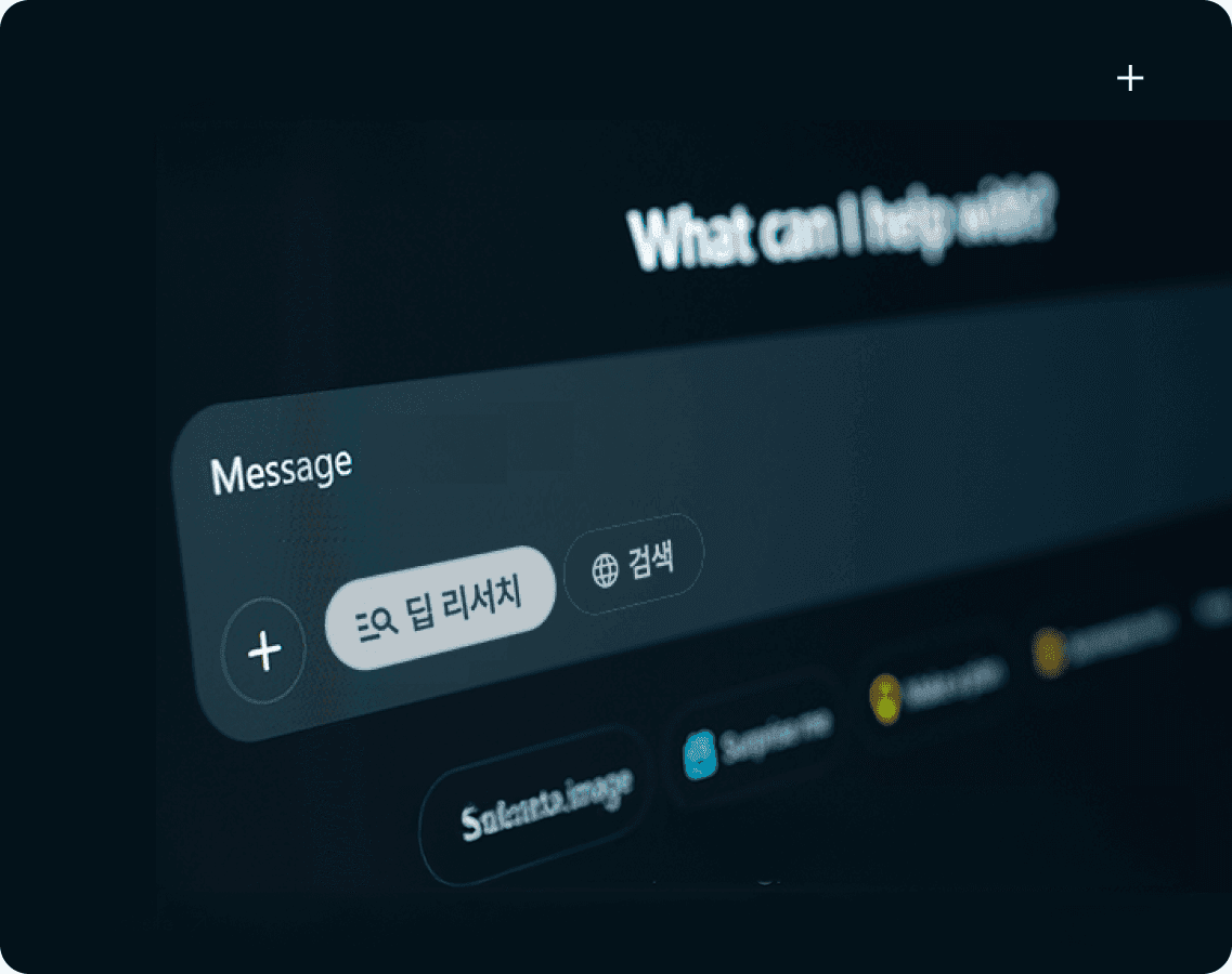 Four diverse professionals collaboratively working on a laptop, with one person pointing at the screen while others observe.