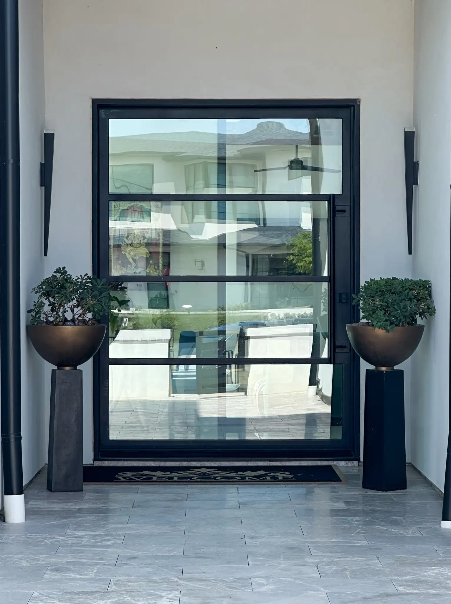 4 lite pivot door installed by M2 Metals Iron Doors on a Southlake home