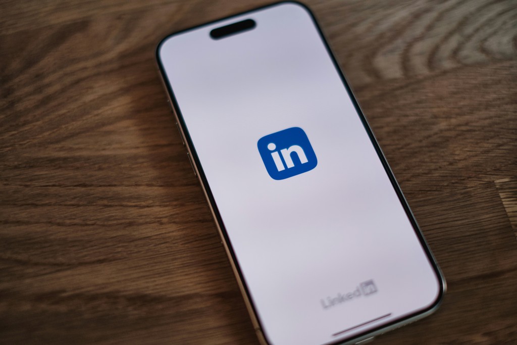 A cell phone with the linkedin logo on it