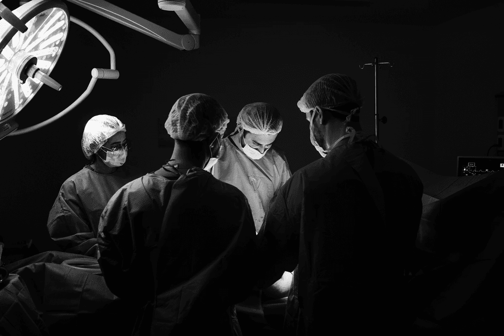 a group of doctors performing surgery on a patient