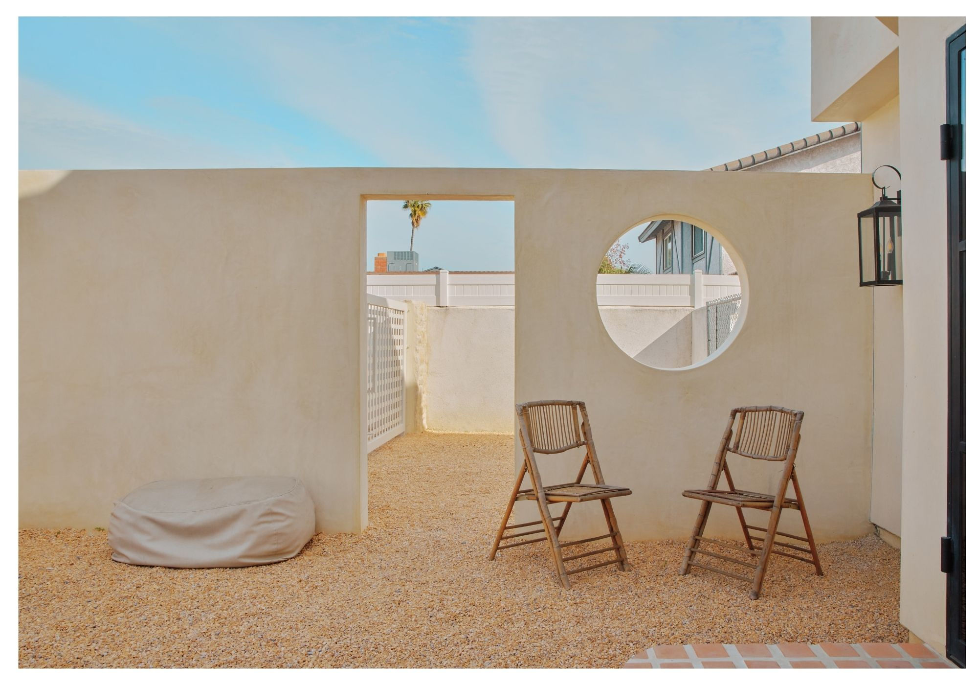 A person walks past buildings on a city street.