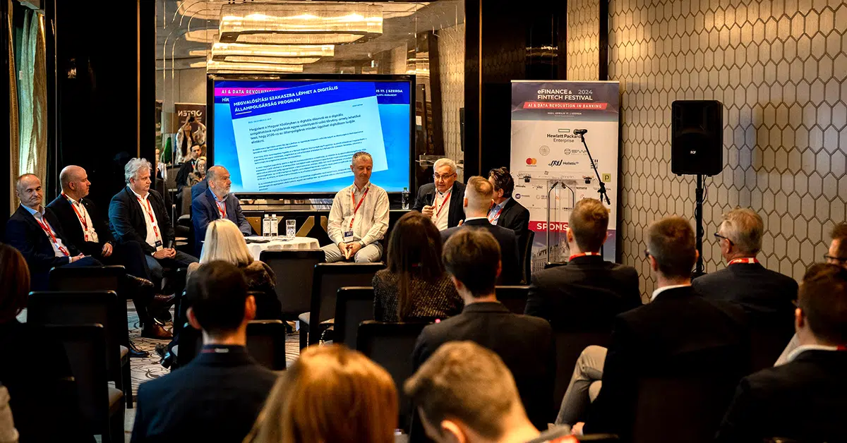 A panel discussion at the eFinance Fintech Festival, where industry experts are discussing AI and data revolution in banking. The audience attentively listens as the panelists share insights.