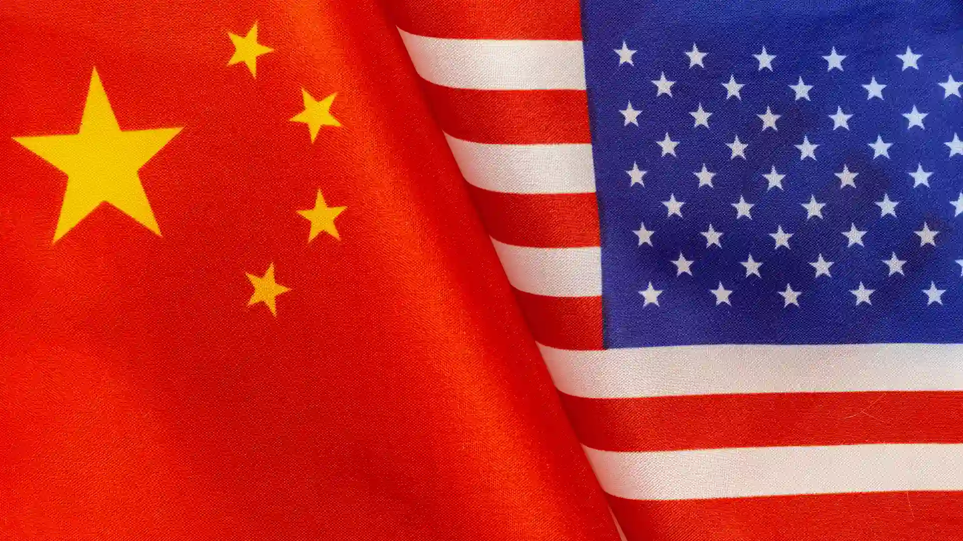 A close-up image of the American and Chinese flags, illustrating the geopolitical tensions and uncertainty surrounding TikTok’s U.S. deal.