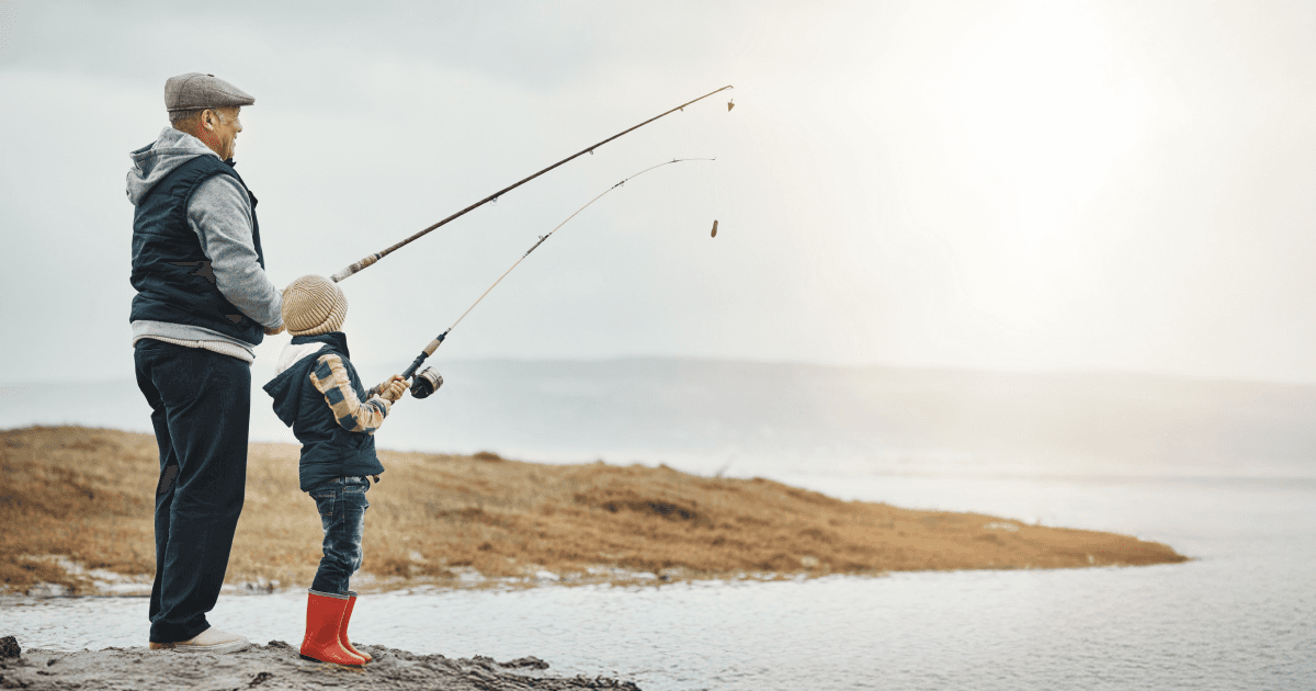 Grandpa fishing with granddaughter