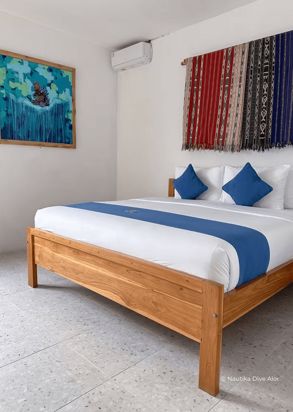 a bed room with two beds and a table