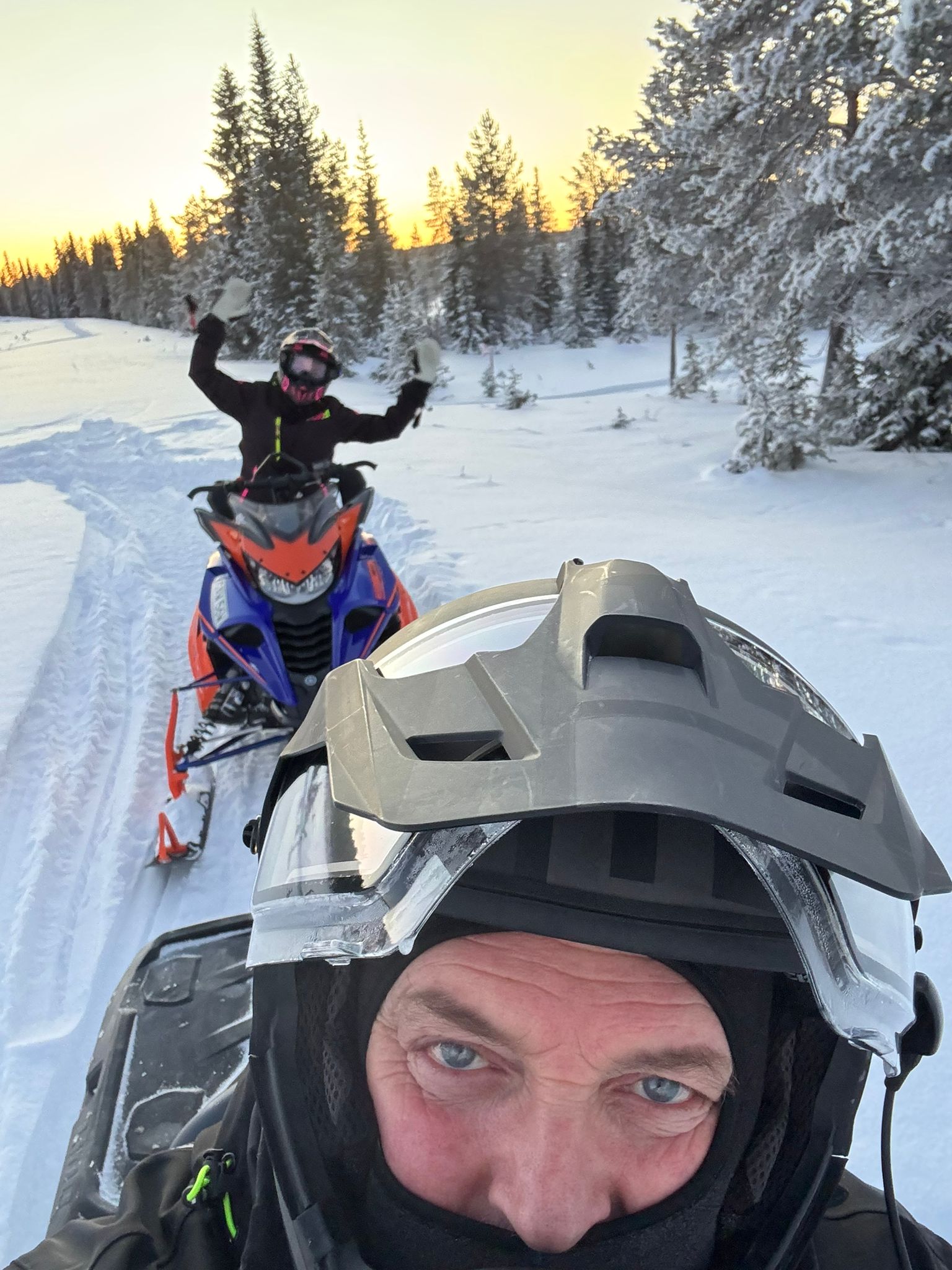 two people riding jet skis on a body of water