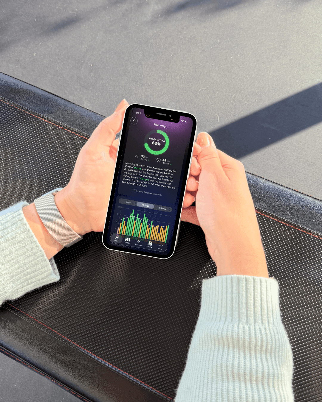 photo of a woman looking at health data in the Athlytic app