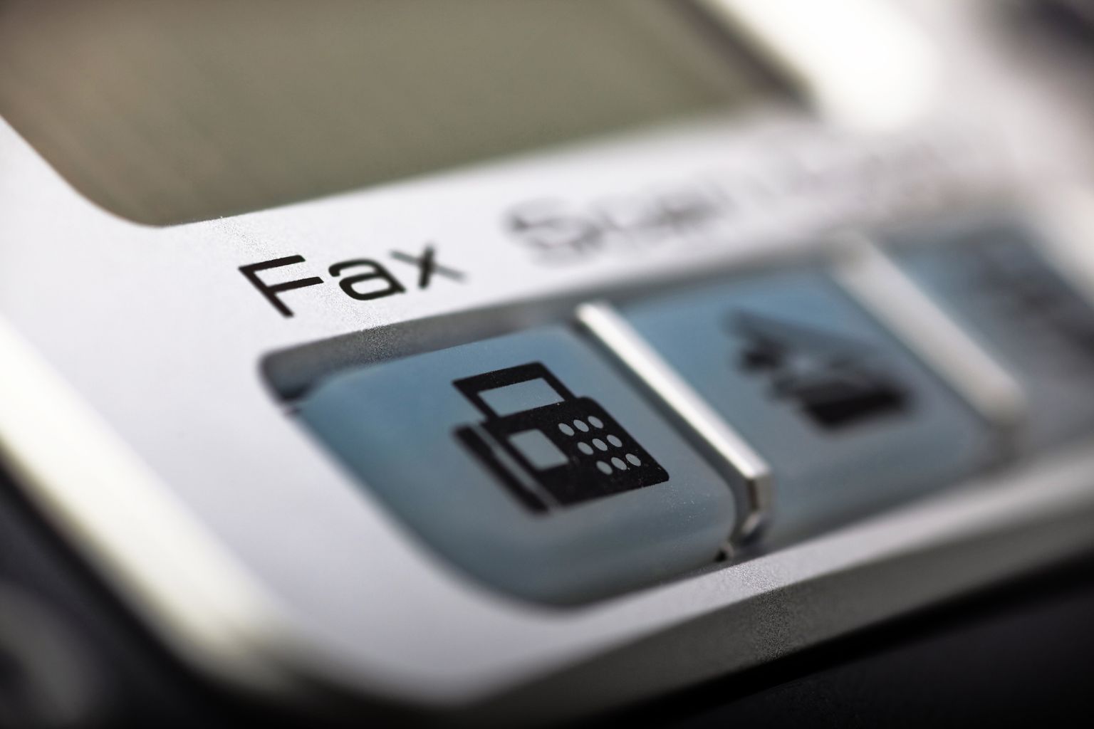 Close up image of a fax machine button