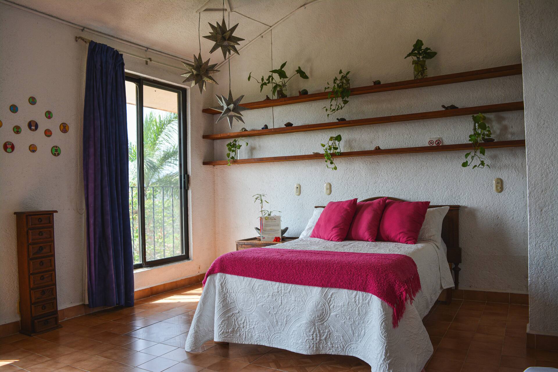 gray padded chaise couch beside window