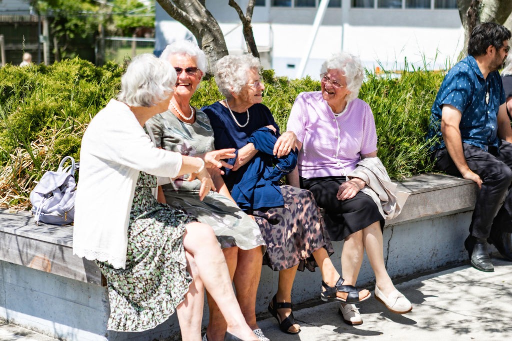 person holding pink and white heart print paper