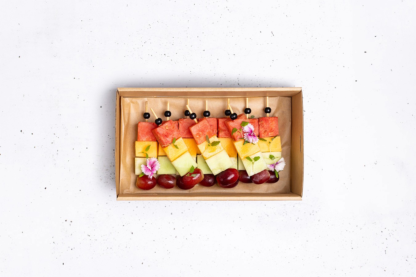 Individual seasonal fruit skewer