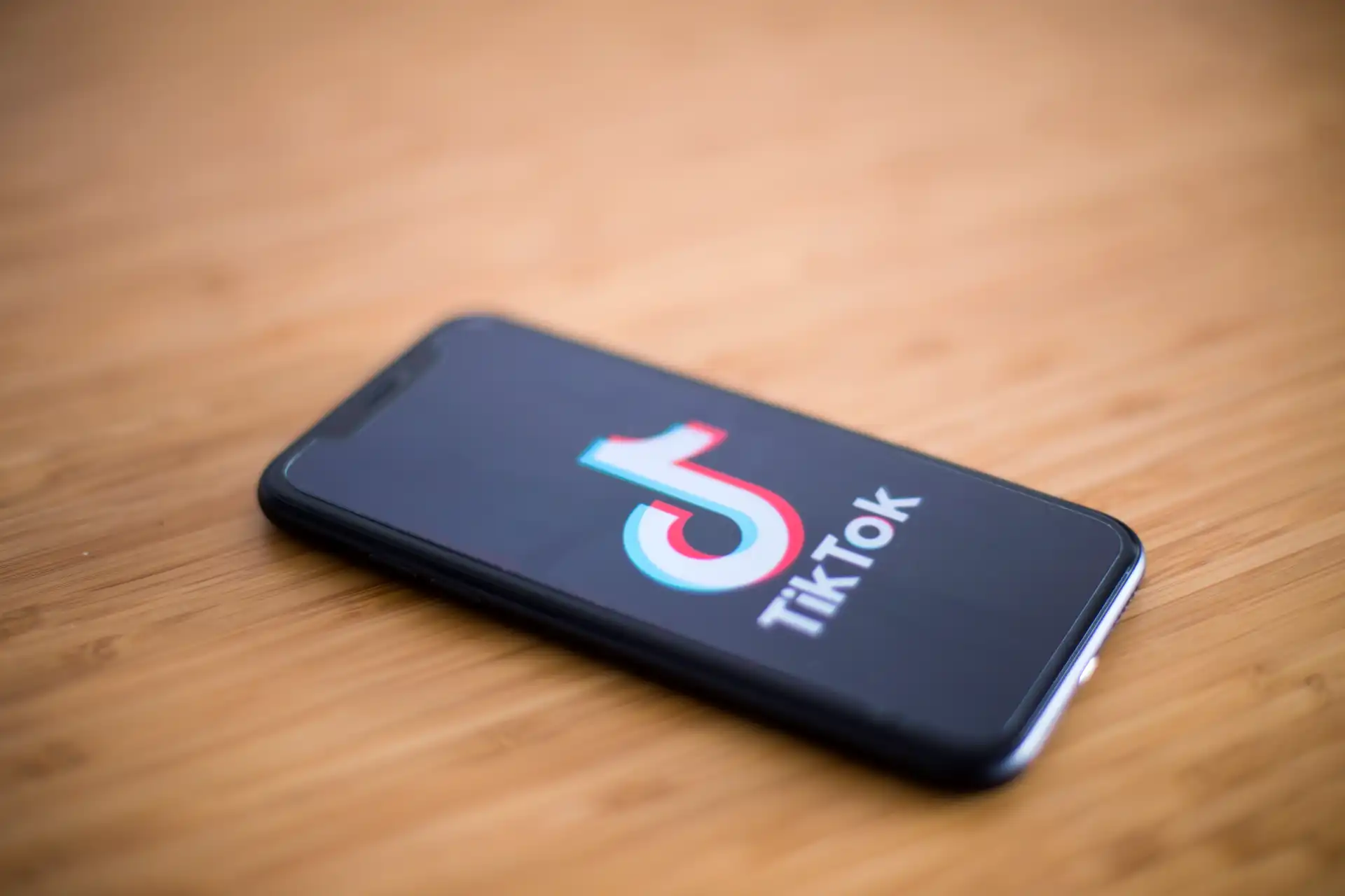 Smartphone displaying TikTok app logo, representing the platform for Zorilla Marketing's shop diagnosis services.