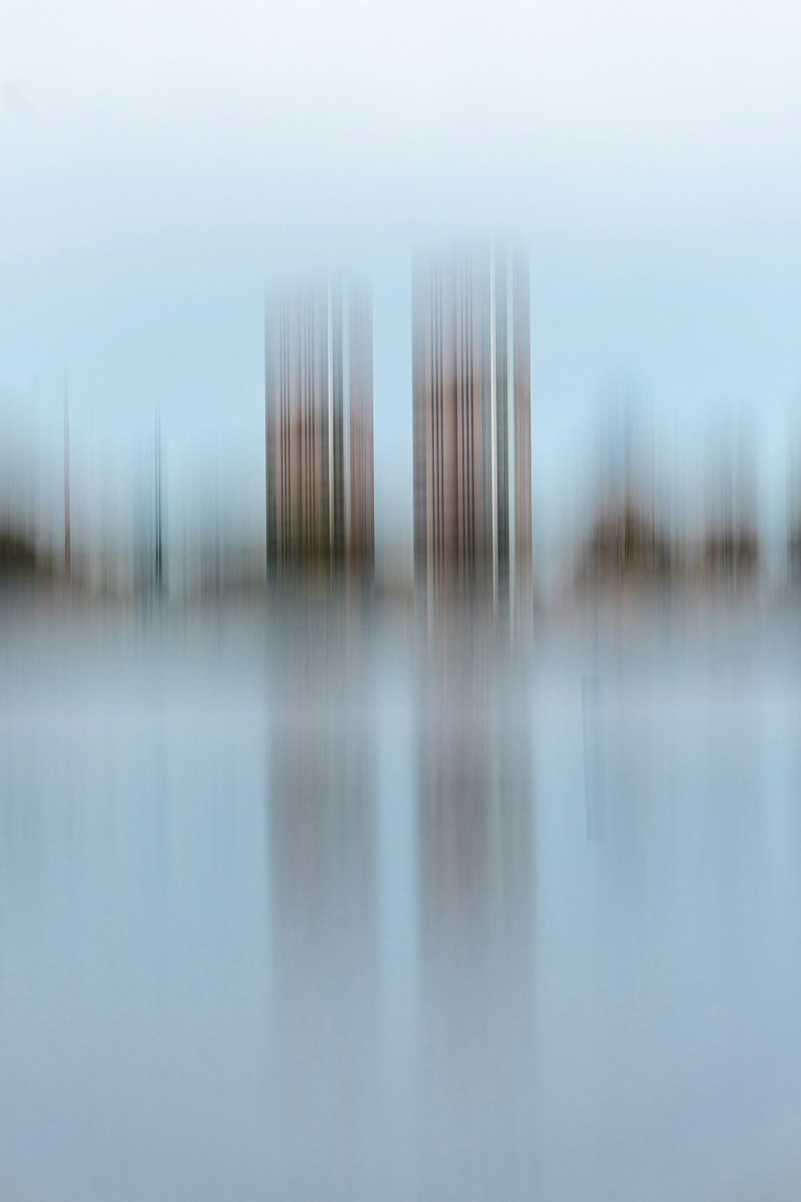 Abstract cityscape with blurred buildings and reflection