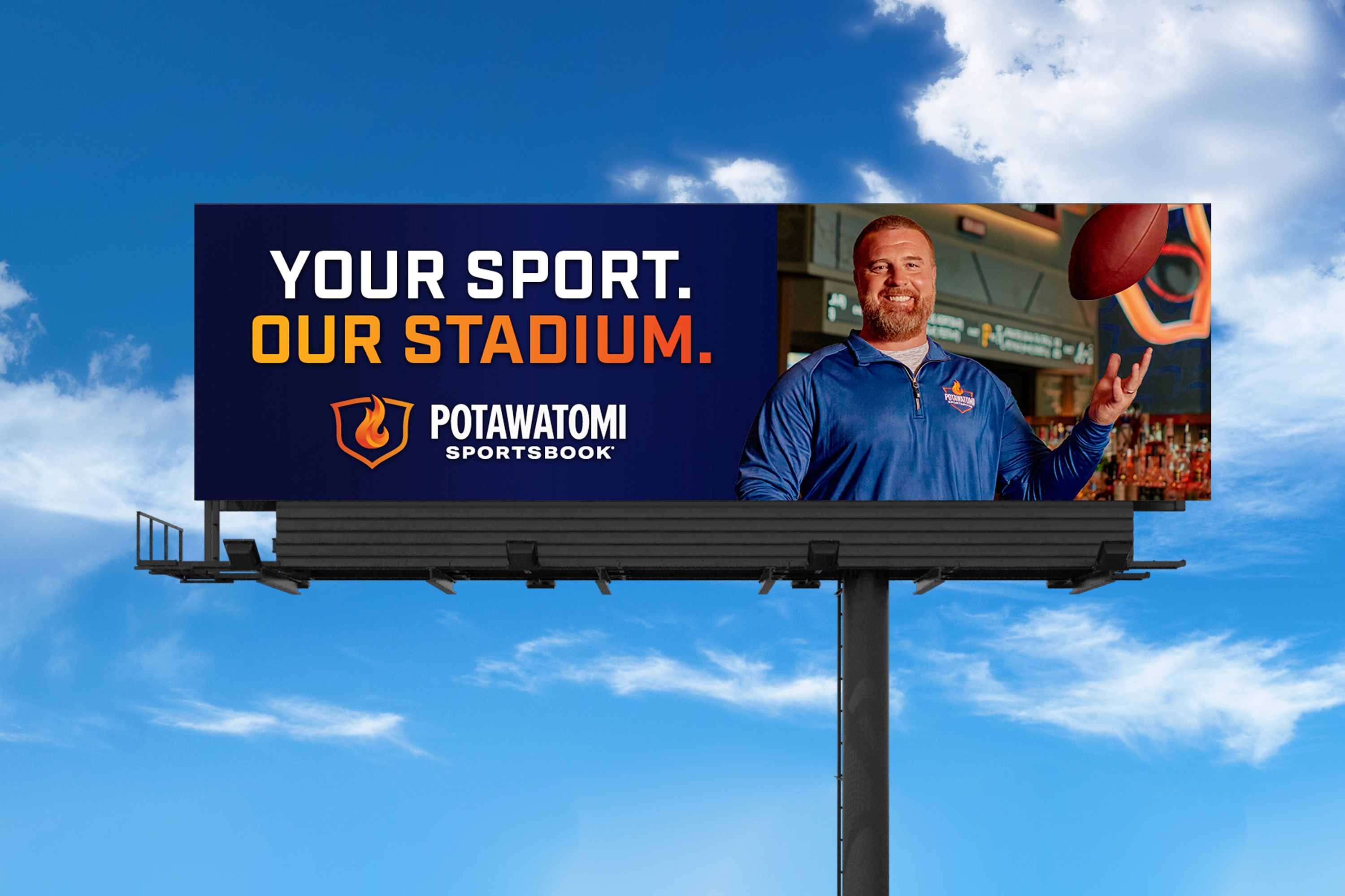Billboard with John Kuhn reads "your sport. our stadium."