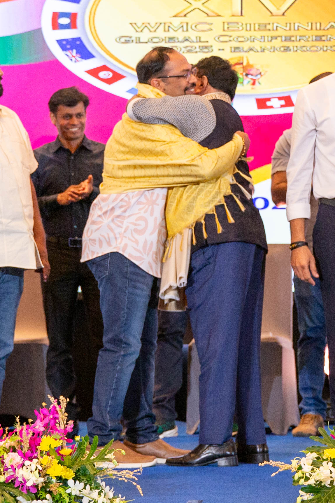 Modern skyscrapers viewed from below at night.