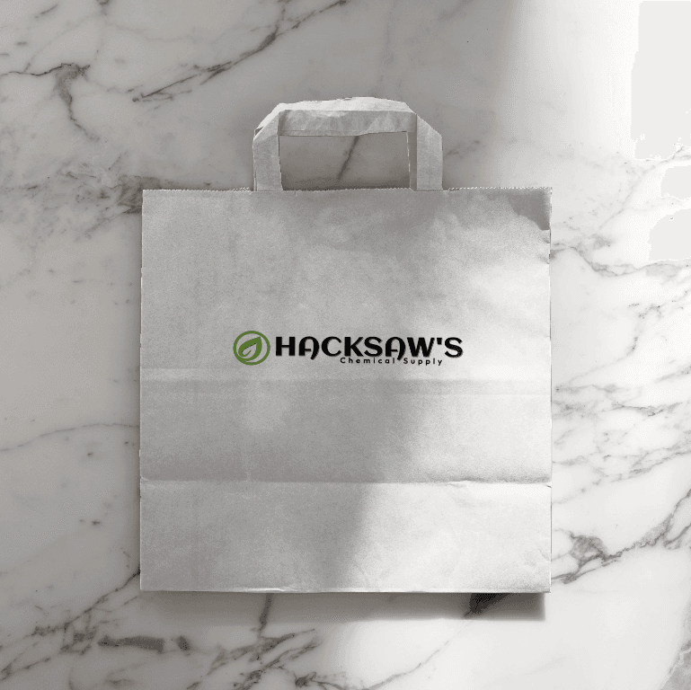 White paper shopping bag with Hacksaw's logo
