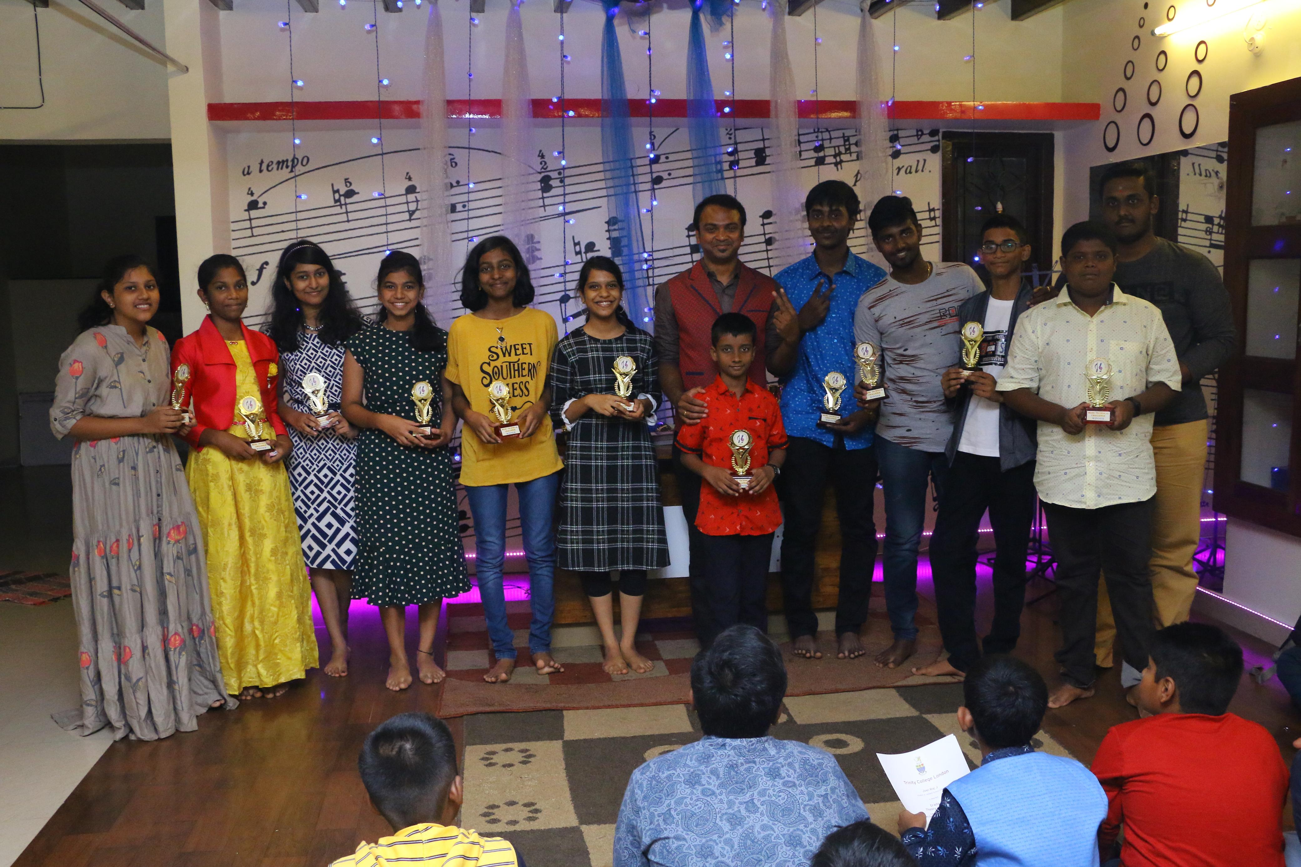 People with eyes closed, hands on chest, singing