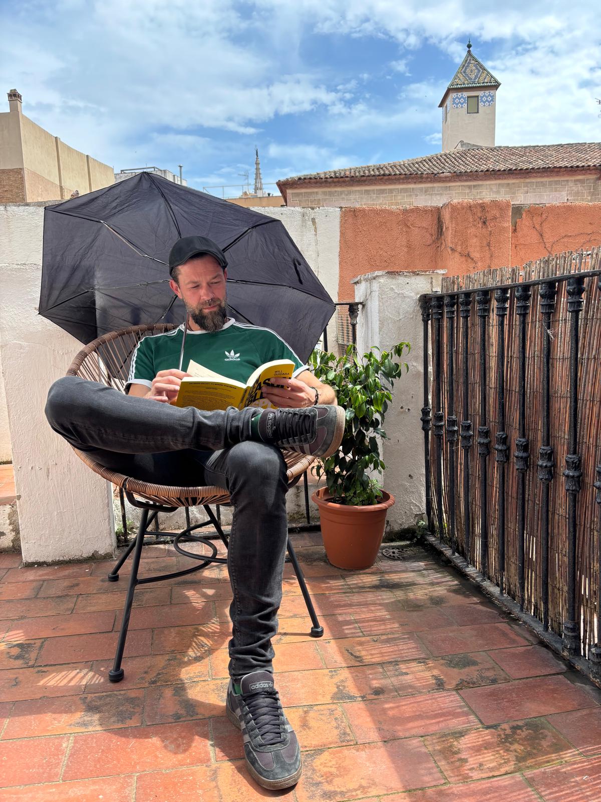 Christoph Karl Knoll reading on a Barcelona terrace