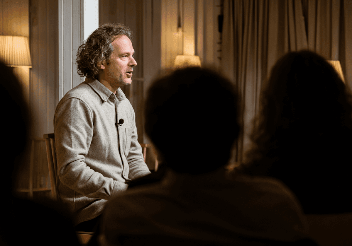 man sitting explaining