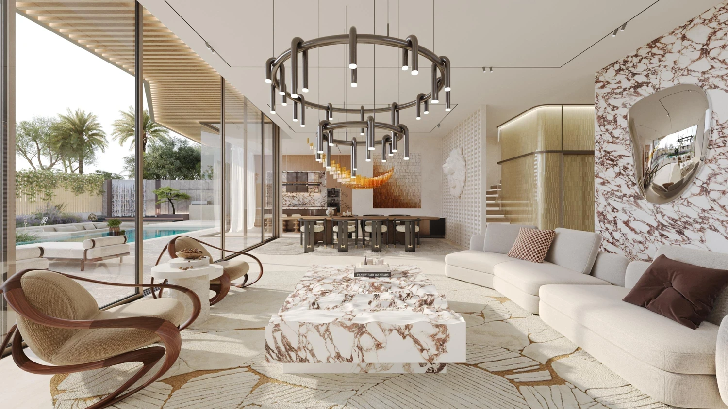 A stylish living room with a circular seating arrangement and a grand chandelier, showcasing Leos Royal design elements.