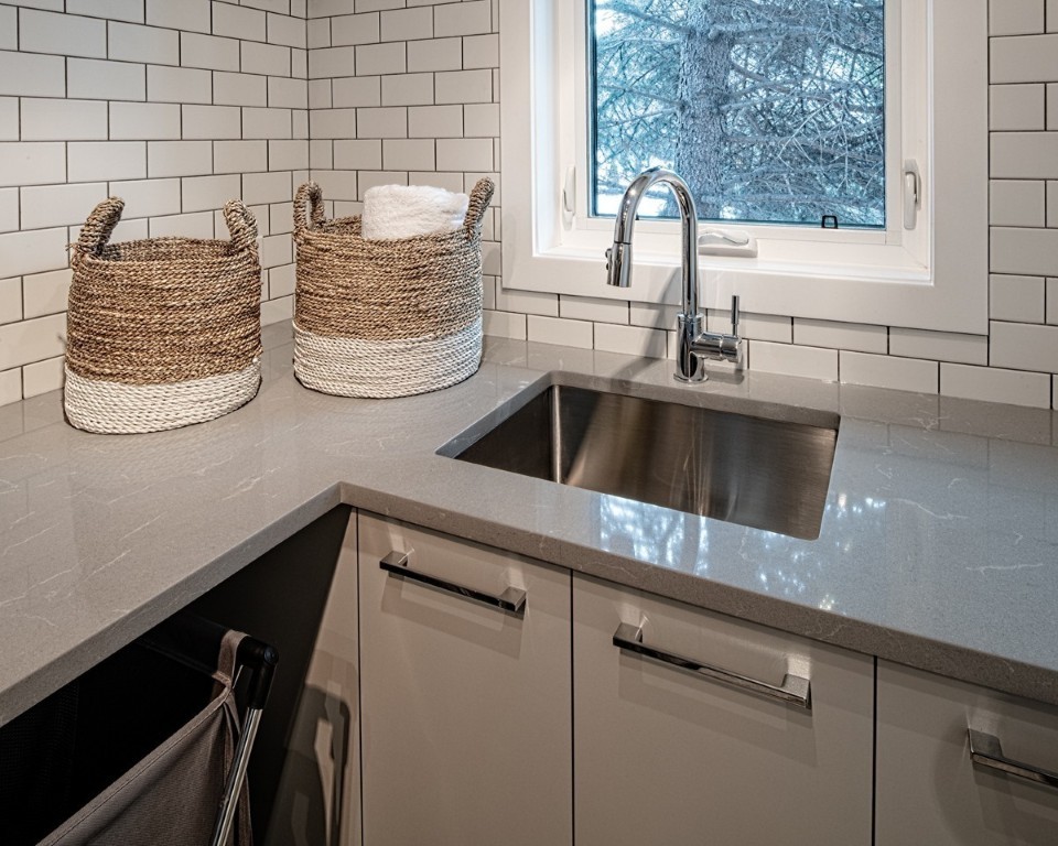 Image of Luxury kitchen design with sink, cabinets, and countertops by KHD Homes, showcasing interior design and renovations.
