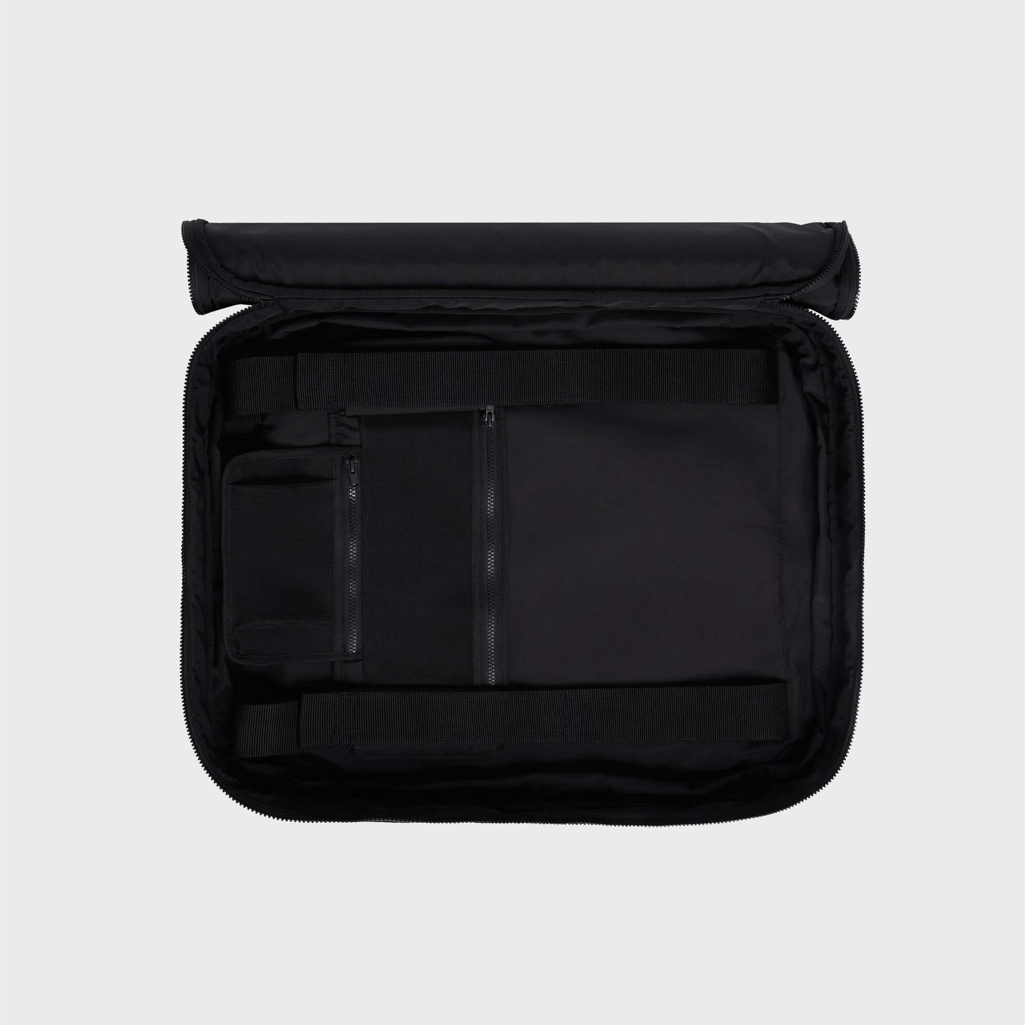 Interior of black travel case with compartments for float, pump, and accessories — sleek and functional storage solution.