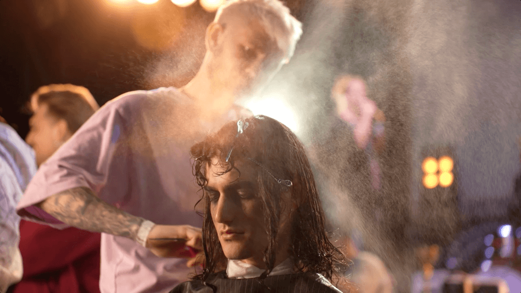 Barber cuts the customer's hair beautifully