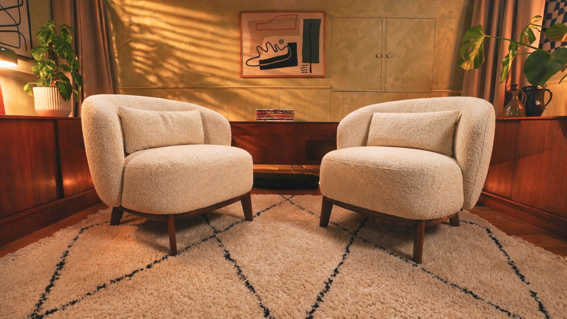 Styled video podcast studio lounge with armchairs, microphones and high-quality audio recording