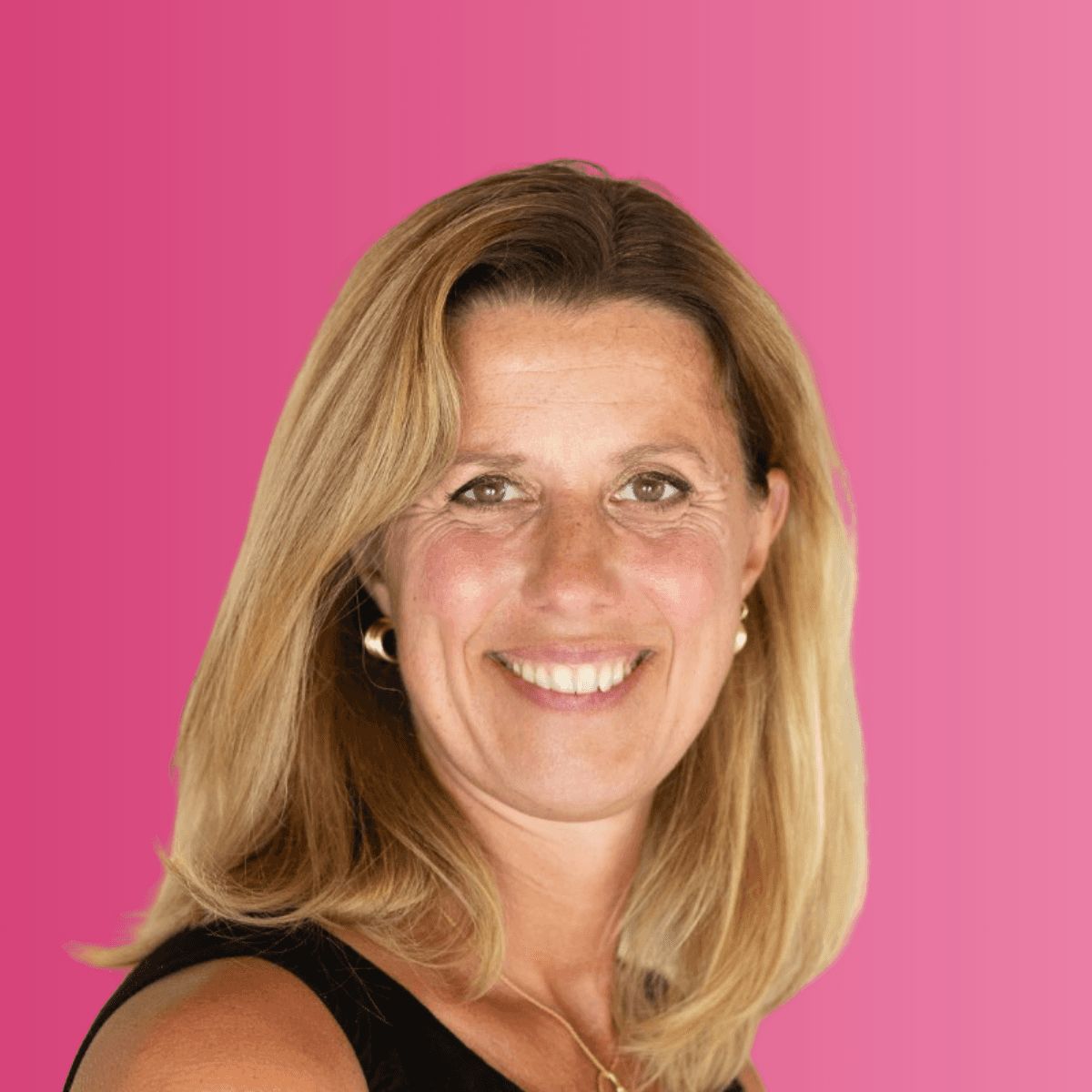 woman sitting around table holding tablet
