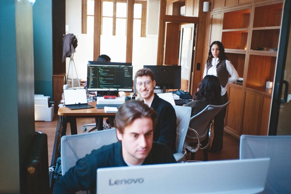 uncovr ai office with computer monitors and desks in paris