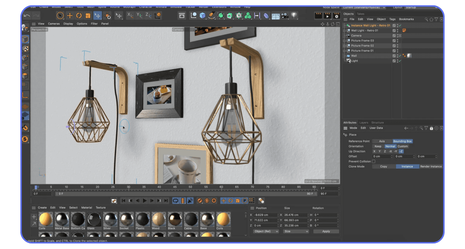 Cinema 4D workspace showing a 3D interior scene with modern hanging lamps and picture frames arranged on a wall.