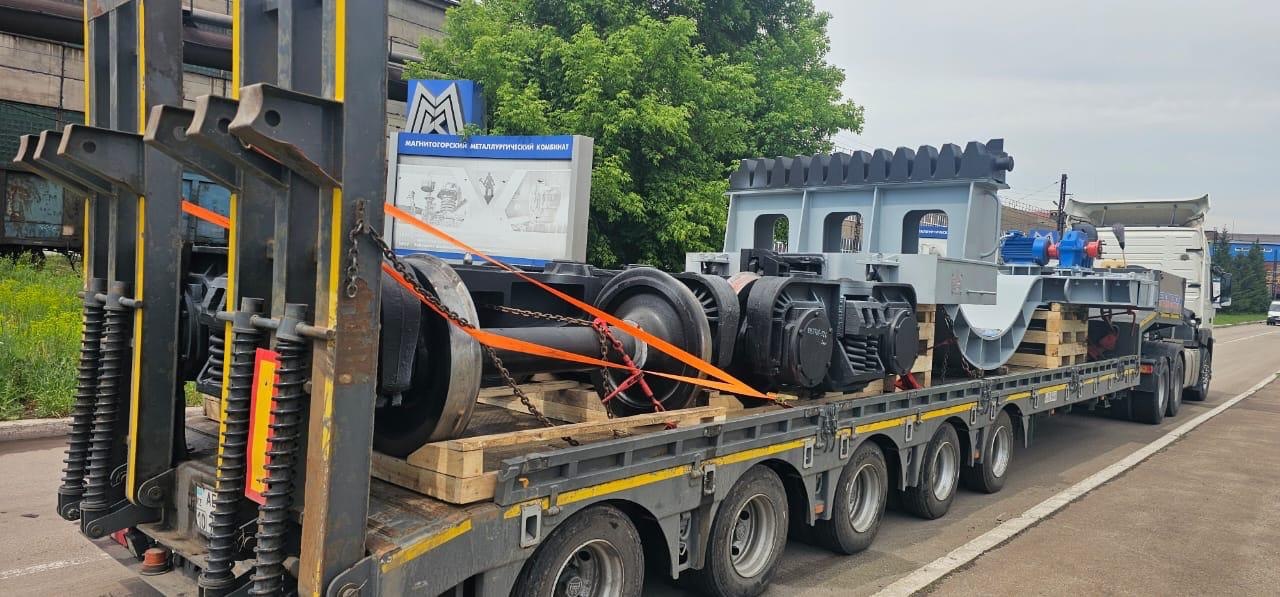Man & woman stand in front of a few boxes