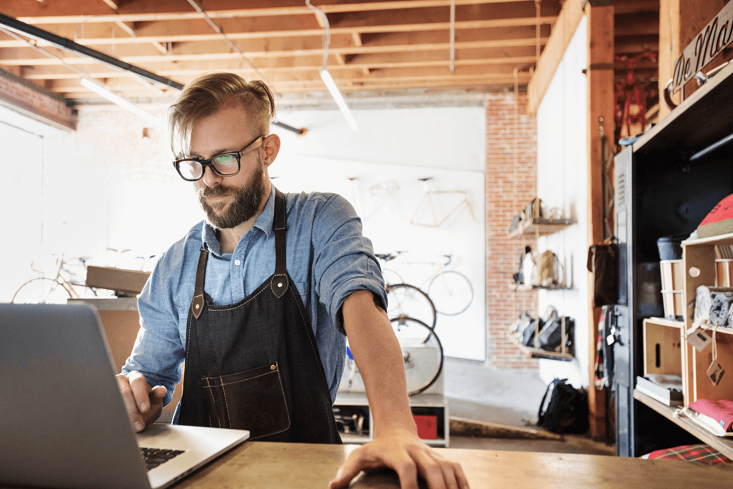 person sitting on grass and using phone