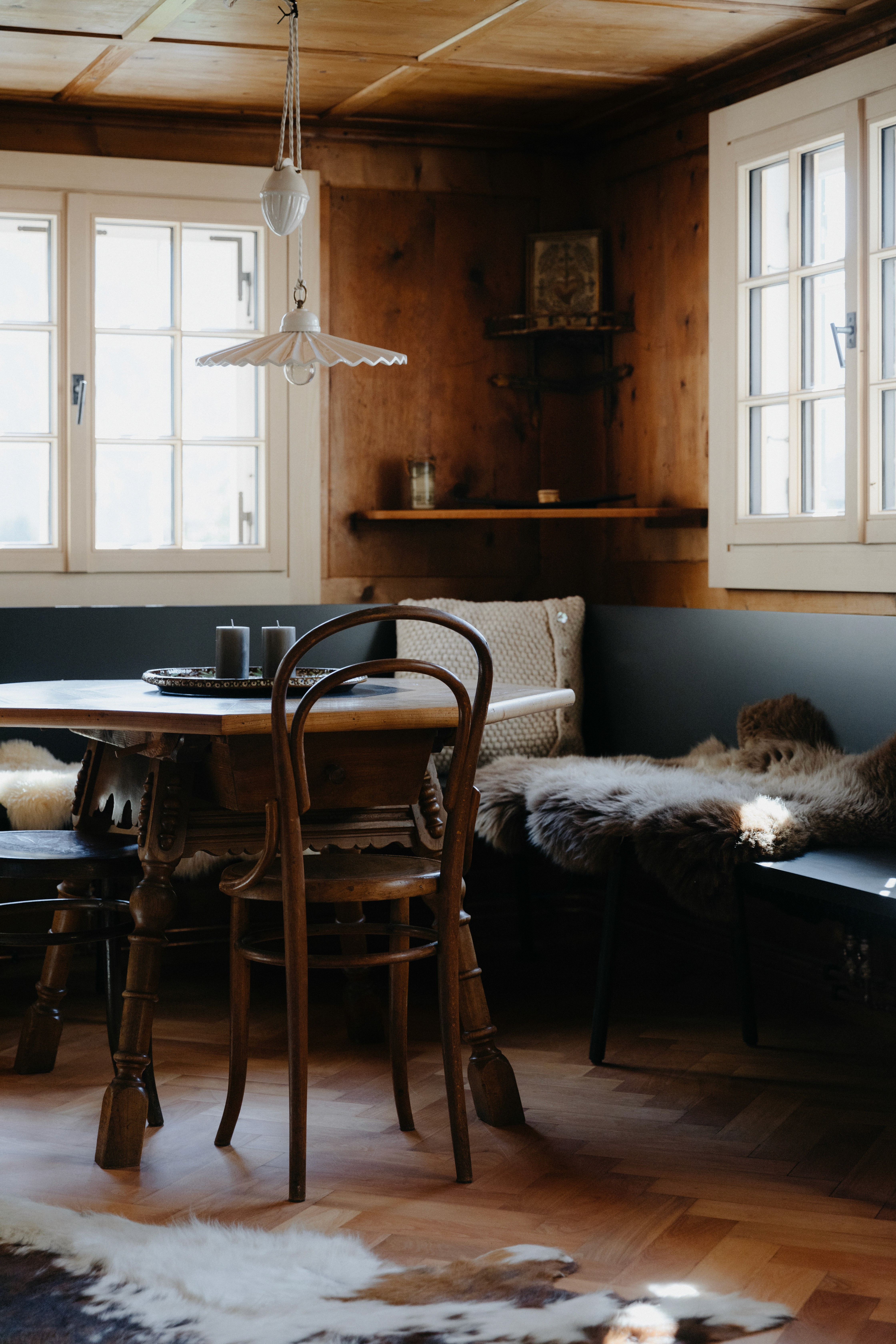 A wooden dining table with a wooden chair.