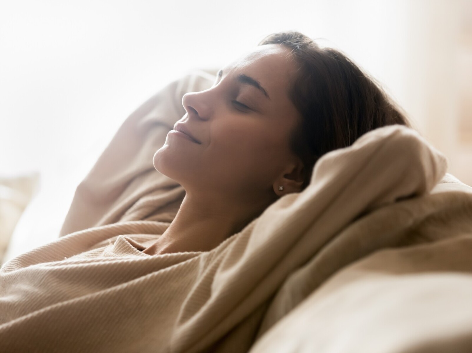 woman resting at home after following a routine for how to lose weight in a sauna for the rest of the week