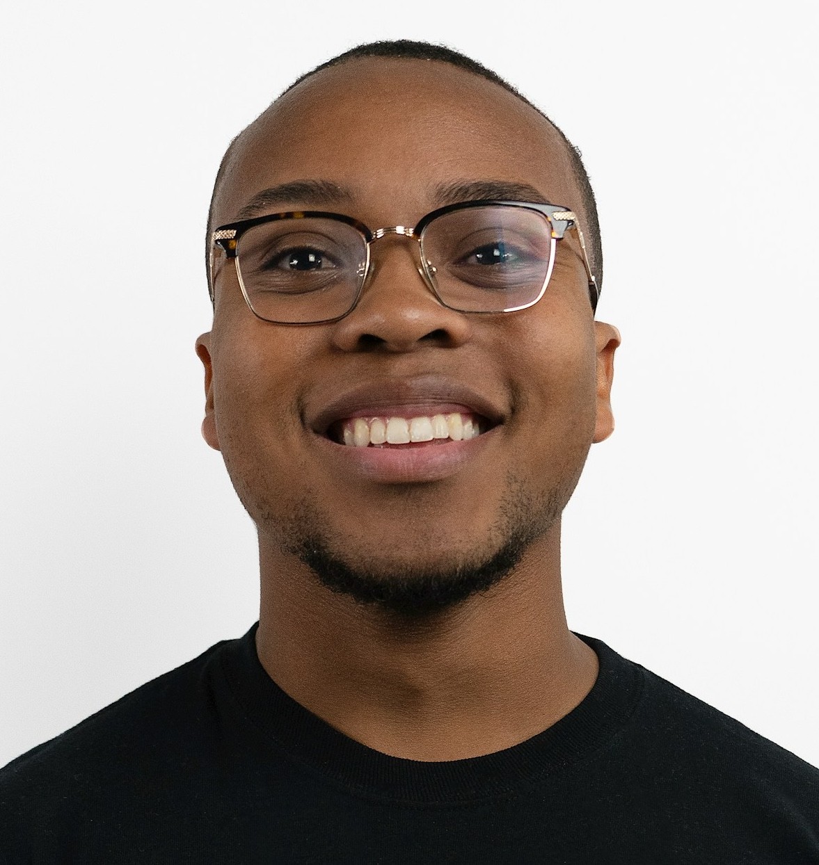 Headshot of smiling black man