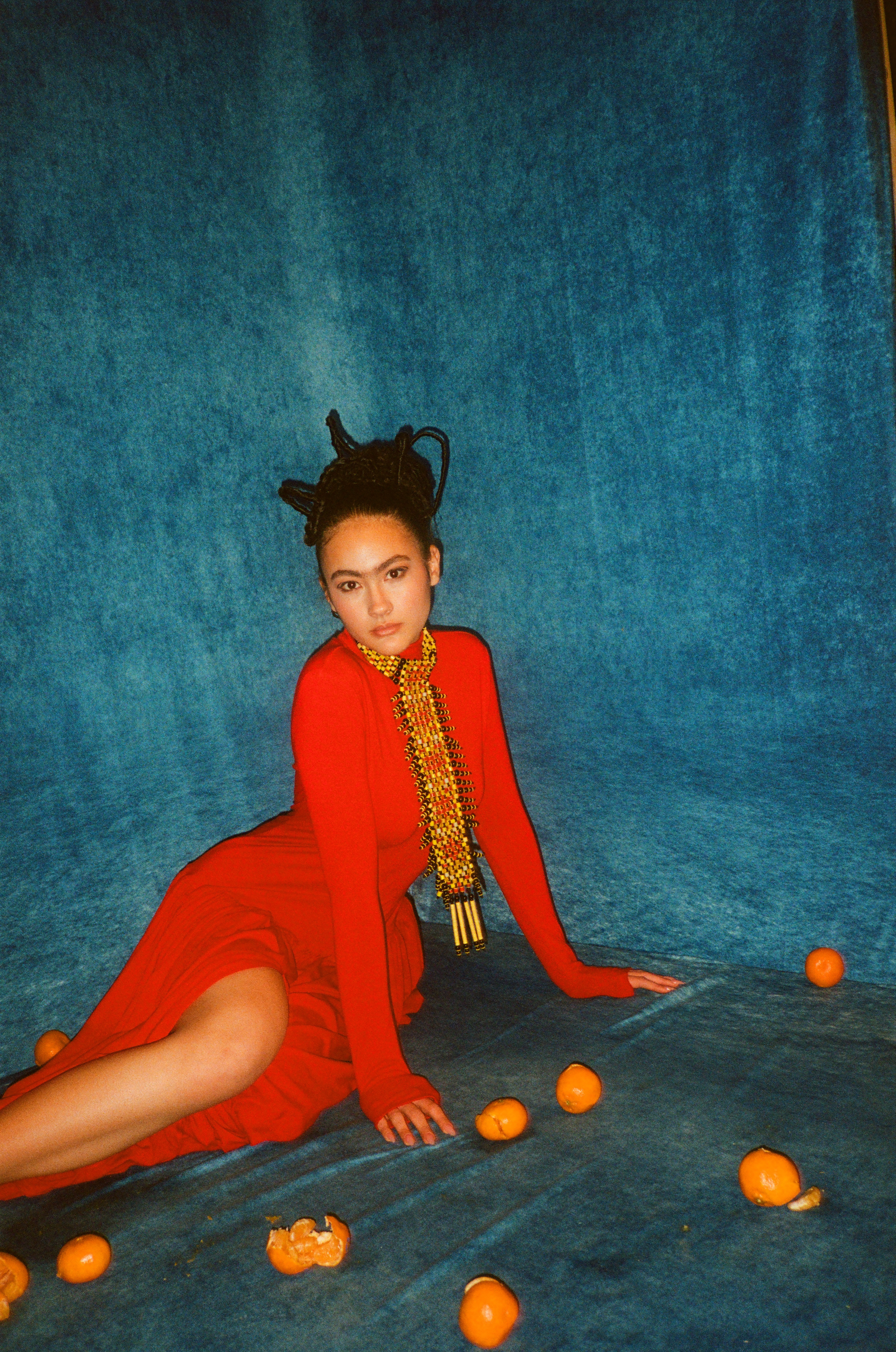 Woman with red hair covering mouth with hair