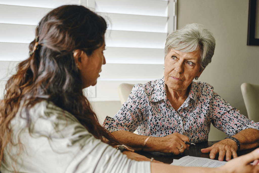 lady talking to elderly woman