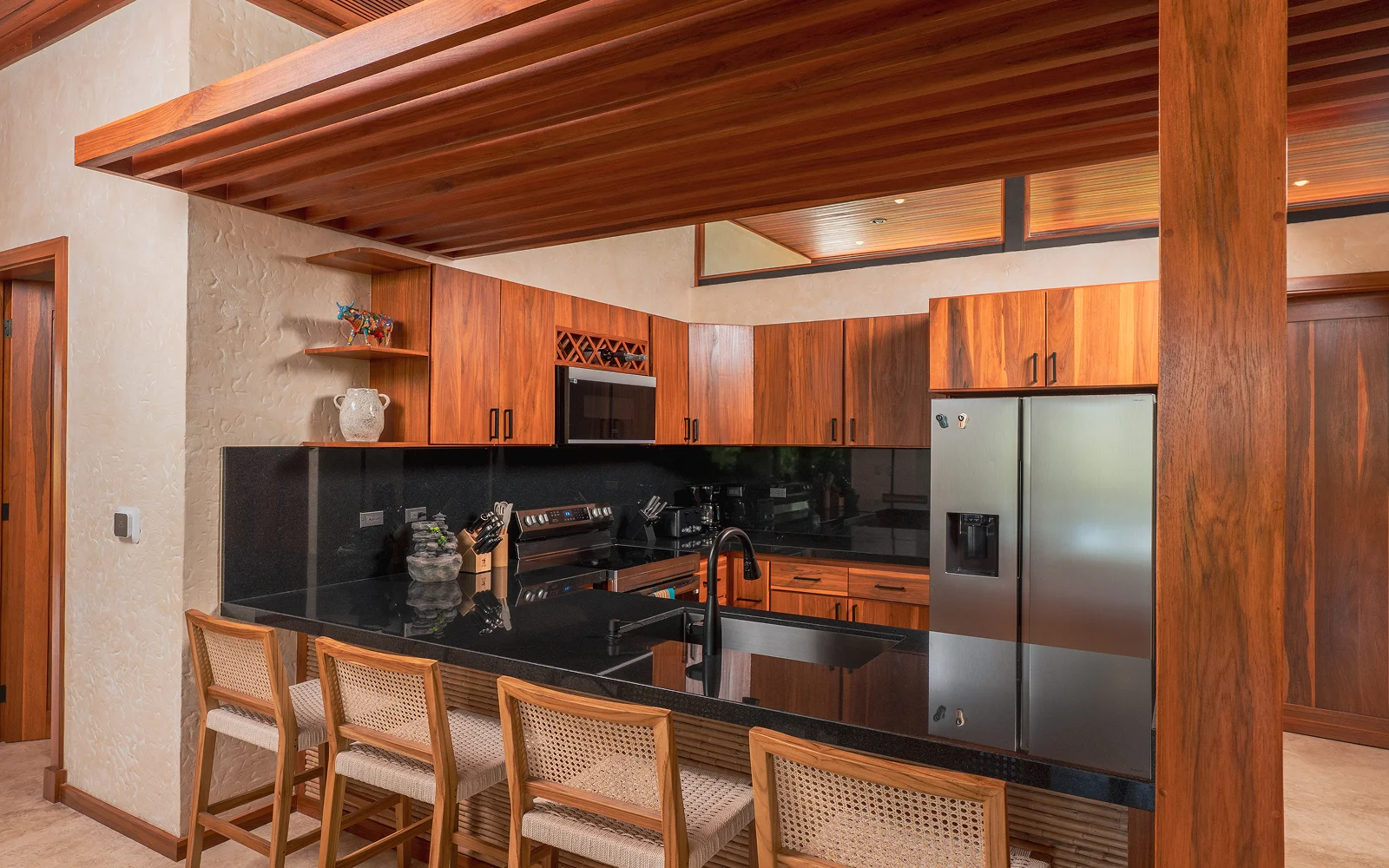 A kitchen in a villa at Arenal Hills