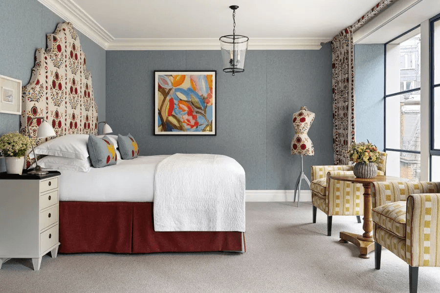 a room with a table chairs and plants