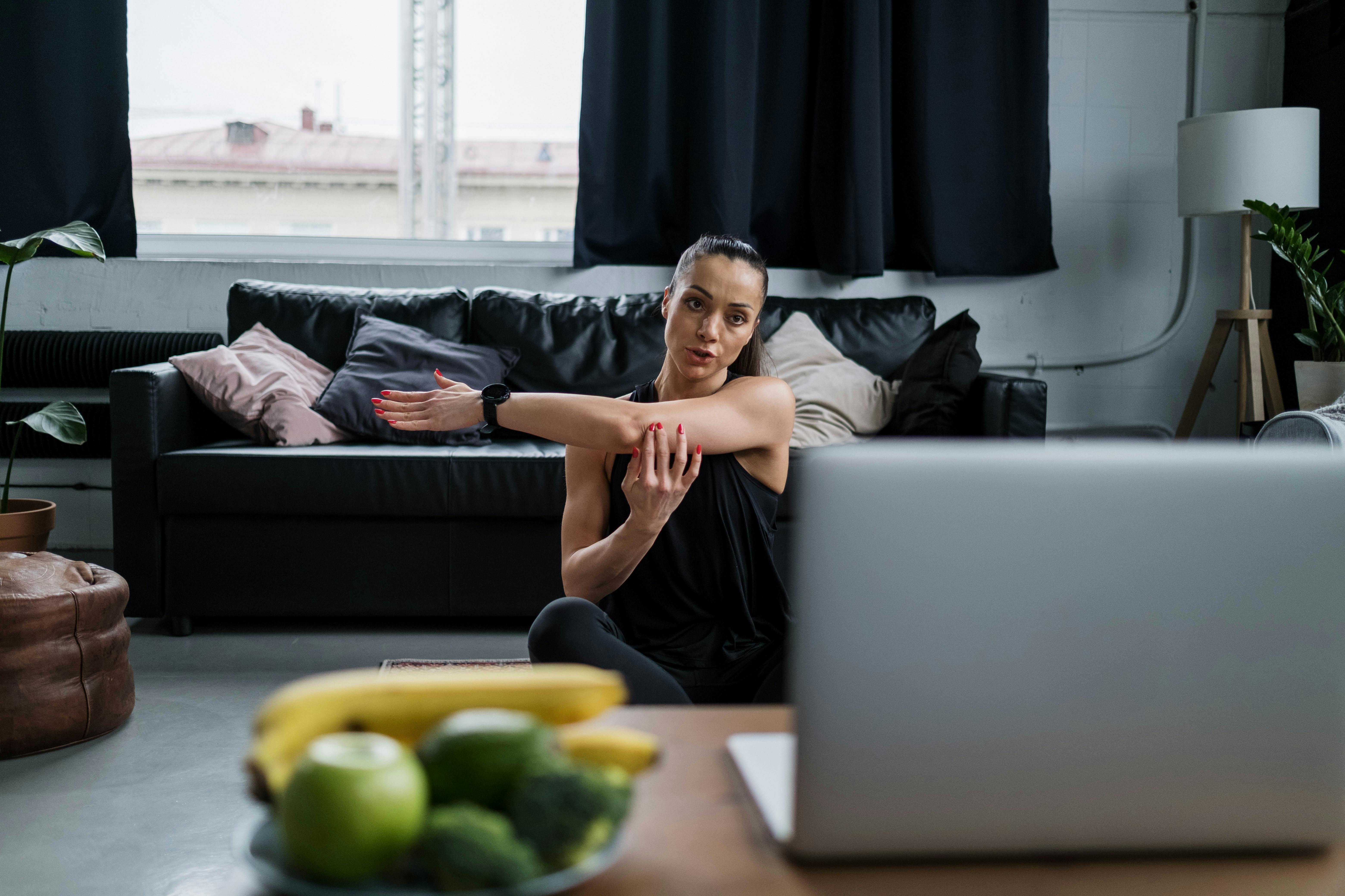 woman doing stretching exercises at home