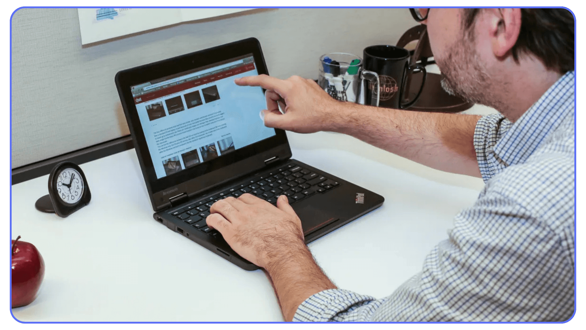 User working on a laptop using browser-based applications and remote desktop software
